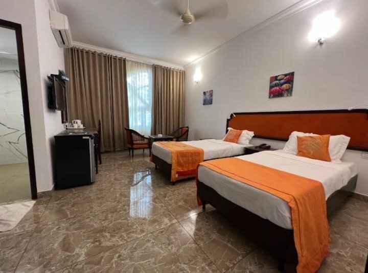 Deluxe twin AC room at ATS Willingdon Hotel Kochi