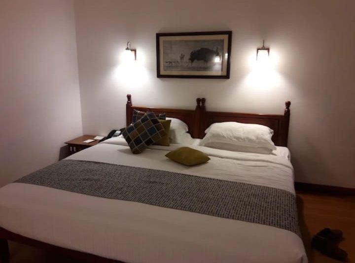 Double bed with wall lamps