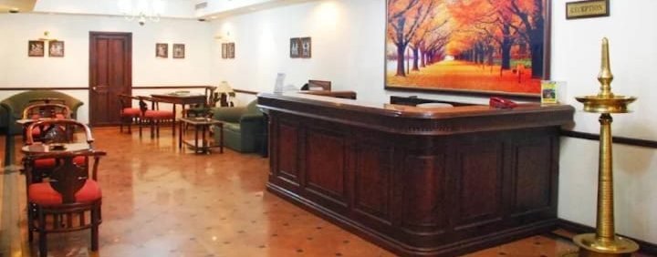 Reception desk with brass lamp